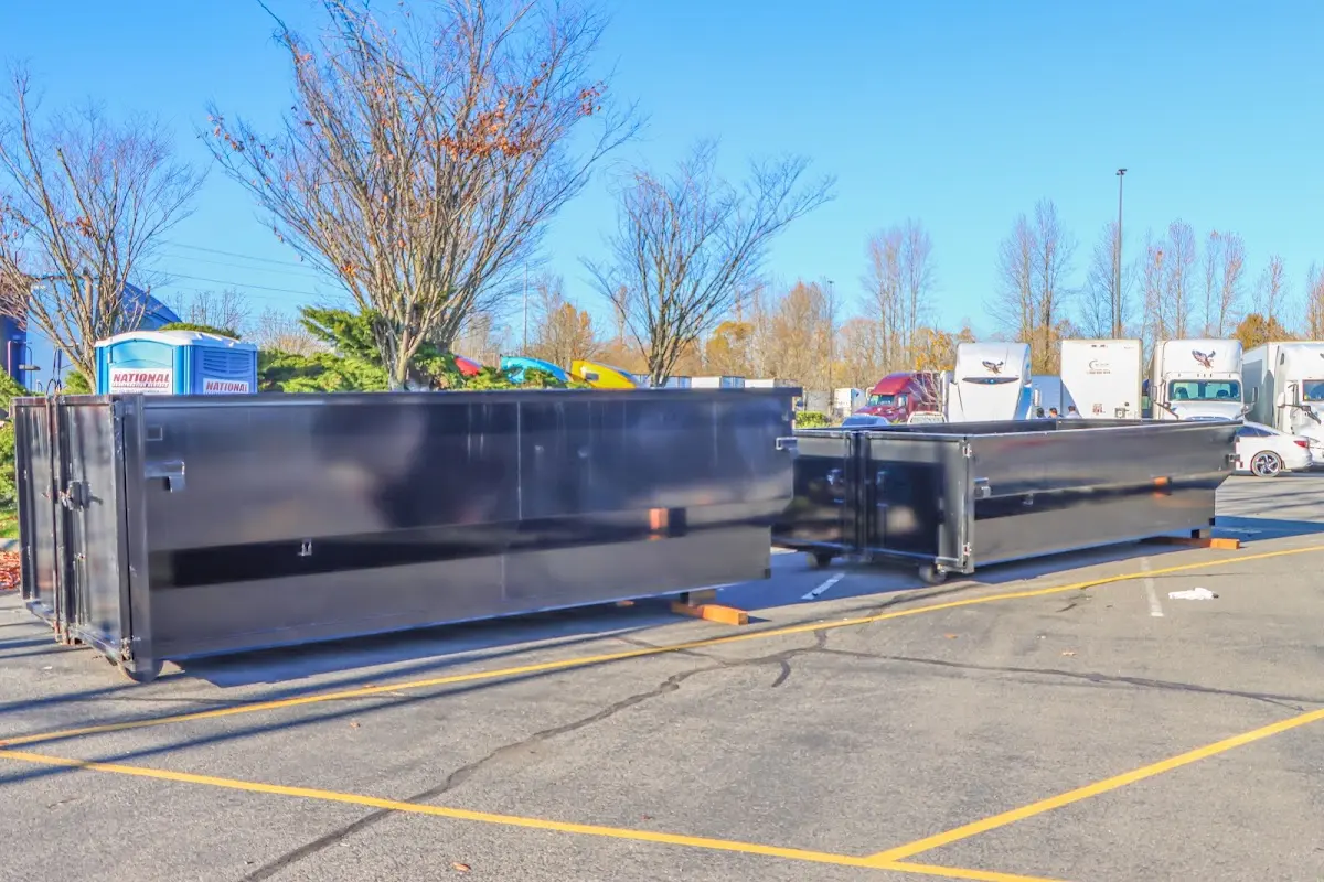 Professional dumpster rental service with roll-off container on residential driveway in Marco Island